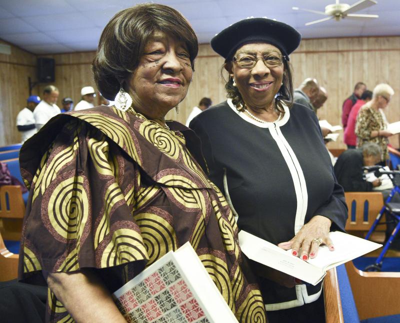 Leonia Robinson and Reba Hollingsworth get ready to sing a gospel hymn.